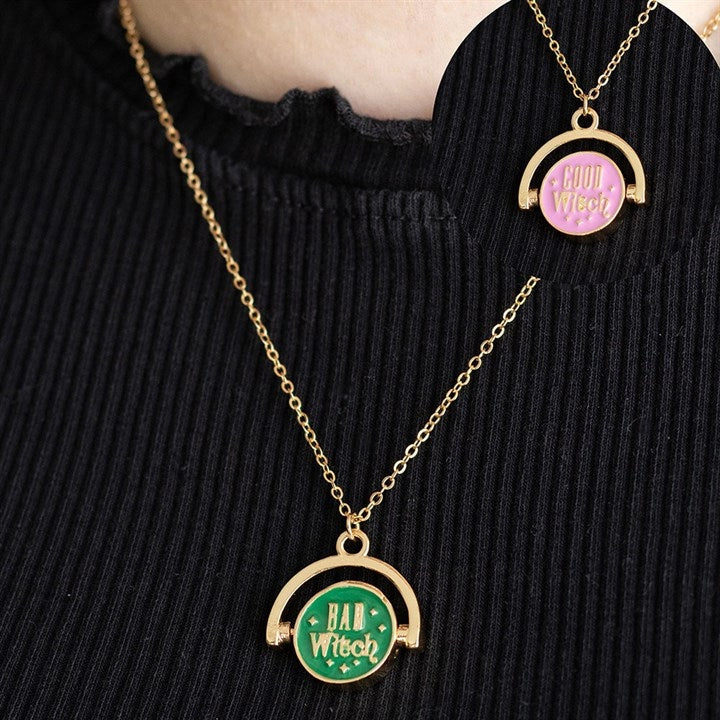 Reversible witch necklace with Good Witch and Bad Witch charms.