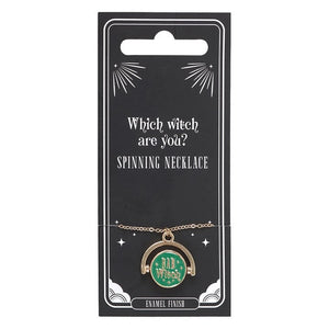 Spinning witch mood necklace worn on black top.