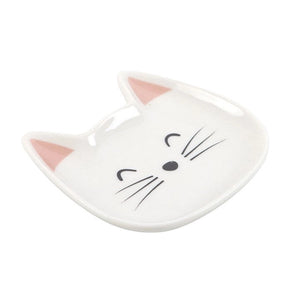 Side view of white cat trinket dish showing pink ear detail and smooth glaze.