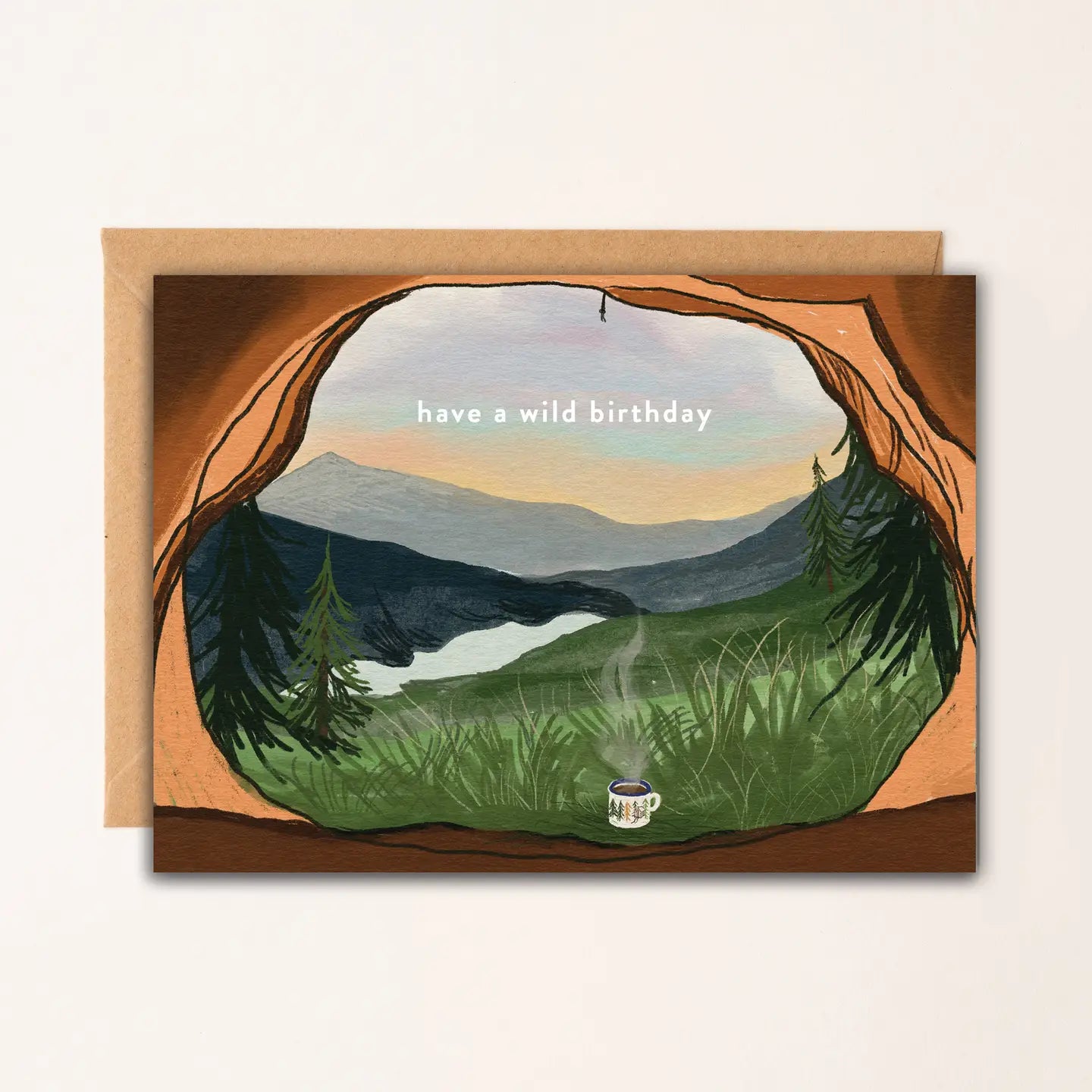 Illustrated Wild Camping Birthday Card showing mountain view from a tent with a steaming mug, printed on textured A6 card with Kraft envelope.