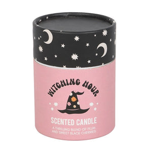 Close-up of Witching Hour scented candle packaging with celestial-themed black and pink tube, showcasing whimsical witch hat design and product scent.