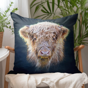 Little Highlander Highland Cow Suede Cushion styled in a cosy home setting, highlighting its soft faux suede texture and Scottish-inspired design.