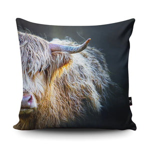 A close-up of the Peekaboo Highland Cow suede cushion, displaying its vibrant details and plush texture.