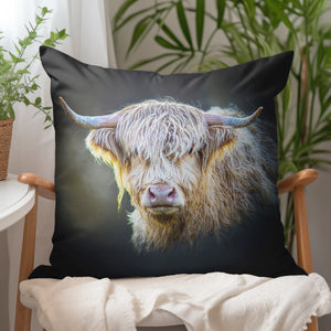 Shadow Gaze Highland Cow Suede Cushion on a wooden chair, showcasing the detailed design of the Highland cow.