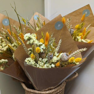 Side view showcasing yellow floral accents and wheat stems.