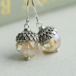 A pair of Yellow Opal Acorn Earrings with sparkling silver flecks in the glass