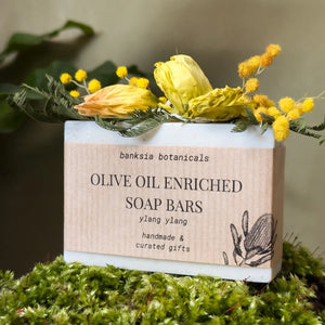 Handmade Ylang Ylang scented soap bar with olive oil and dried flowers.