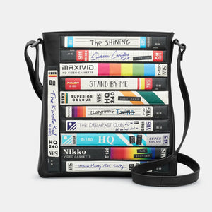 Yoshi Be Kind Rewind Bryant Leather Cross Body Bag in black with a retro VHS-inspired appliqué design on the front.