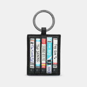 Front View: Yoshi Be Kind Rewind Leather Keyring featuring a retro VHS tape stack design.