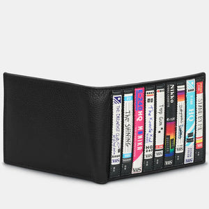 Side View: A standing view of the wallet, showing its slim profile and retro VHS-style design.