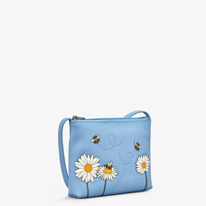 Side angle: Side view of Yoshi bee and daisy leather bag showing depth and stitching details.