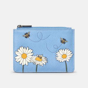 Front of blue leather zip purse with appliquéd bees and daisies and stitched flight paths.