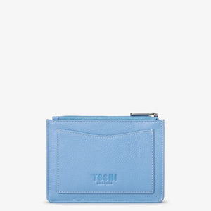 Back of Bee Happy leather purse in blue with outer card slot and embossed Yoshi branding.