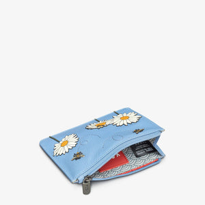 Open view of blue zip-top purse with patterned lining, red label, and space for cards and coins.
