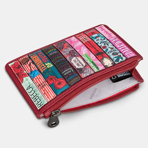 Cherry red leather purse with zip-top open to reveal white fabric-lined interior, showcasing compact space for cards, coins, and notes.