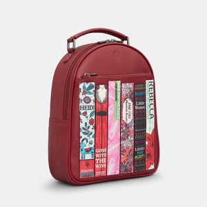 Side angle of Bookworm backpack showing curved top handle and front book detailing.