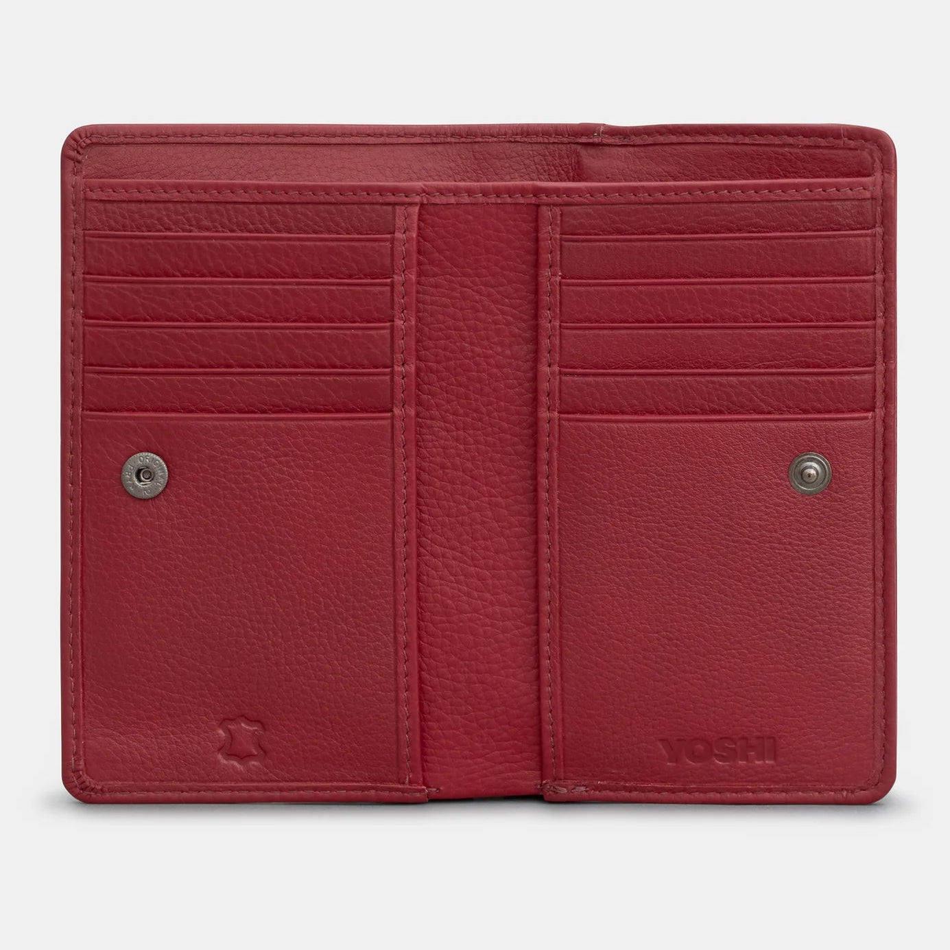Open cherry red leather bookworm purse revealing red and white patterned fabric lining inside the zipped coin section.