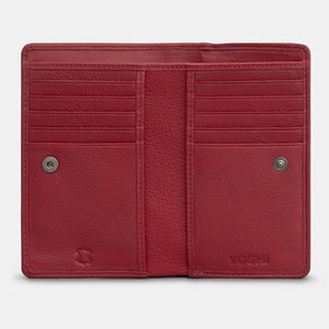 Open cherry red leather bookworm purse revealing red and white patterned fabric lining inside the zipped coin section.