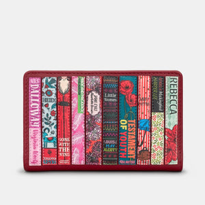 Front view of cherry red leather Oxford purse featuring colourful spine appliqués of classic books by female authors.