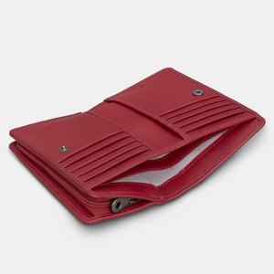Inside view of cherry red leather book purse showing 10 card slots, note sections, and press stud closure in pebbled leather finish.