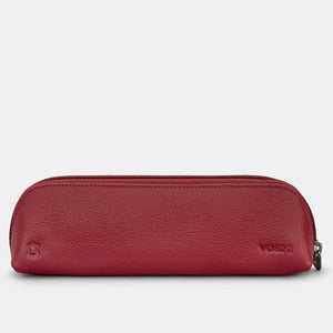 Back of soft red leather pencil case with embossed Yoshi logo and grain finish.