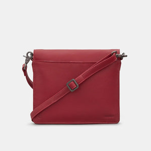 Back view of crossbody bag showing smooth cherry red leather and slip pocket.