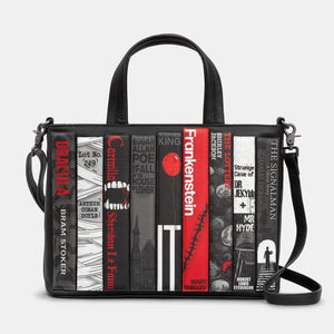 Front view of Horror Bookworm Black Leather Grab Bag featuring horror novel spine appliqués including Dracula and Frankenstein.