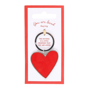 Close-up of You Are Loved Keyring with silver ring and red heart charm.