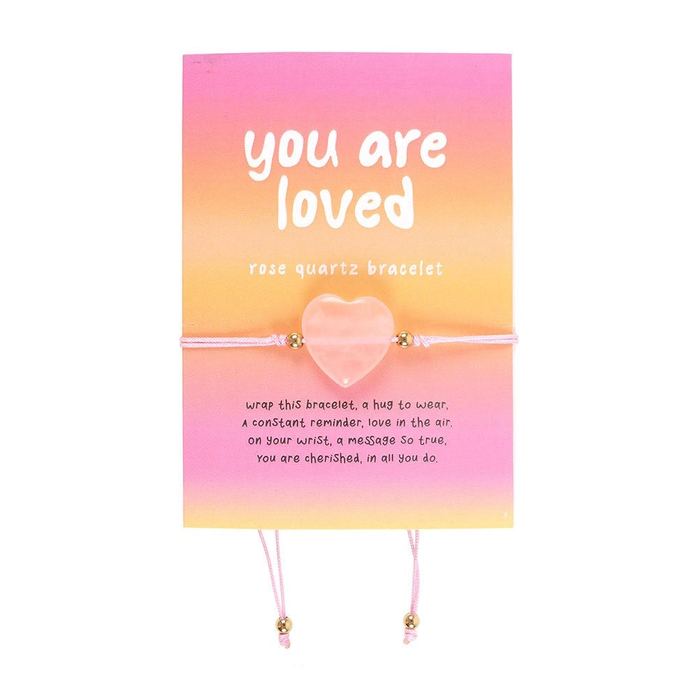 Elasticated rose quartz heart bracelet on card with “You Are Loved” message, ideal self-love or friendship gift.