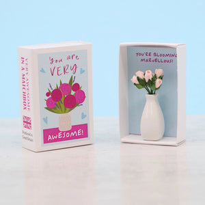 Celebrate someone special with this adorable miniature vase of flowers in a matchbox! A delightful way to show appreciation, encouragement, or simply brighten someone’s day.

Inside this charming matchbox, the recipient will discover a tiny handcrafted vase filled with pink roses, accompanied by the heartfelt message: “You’re Blooming Marvellous!”

A perfect keepsake to express gratitude, admiration, or support, this thoughtful gift brings a lasting smile. Ideal for birthdays, thank yous, or just because!
