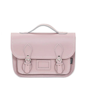 Pink leather satchel with a shoulder strap and buckle closers. 