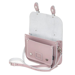 Inside the Leather Satchel in Rose Quartz pink. This image shows this inside pockets and the shoulder strap.