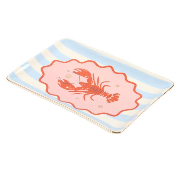 Detail view of red lobster design on pastel striped trinket dish
