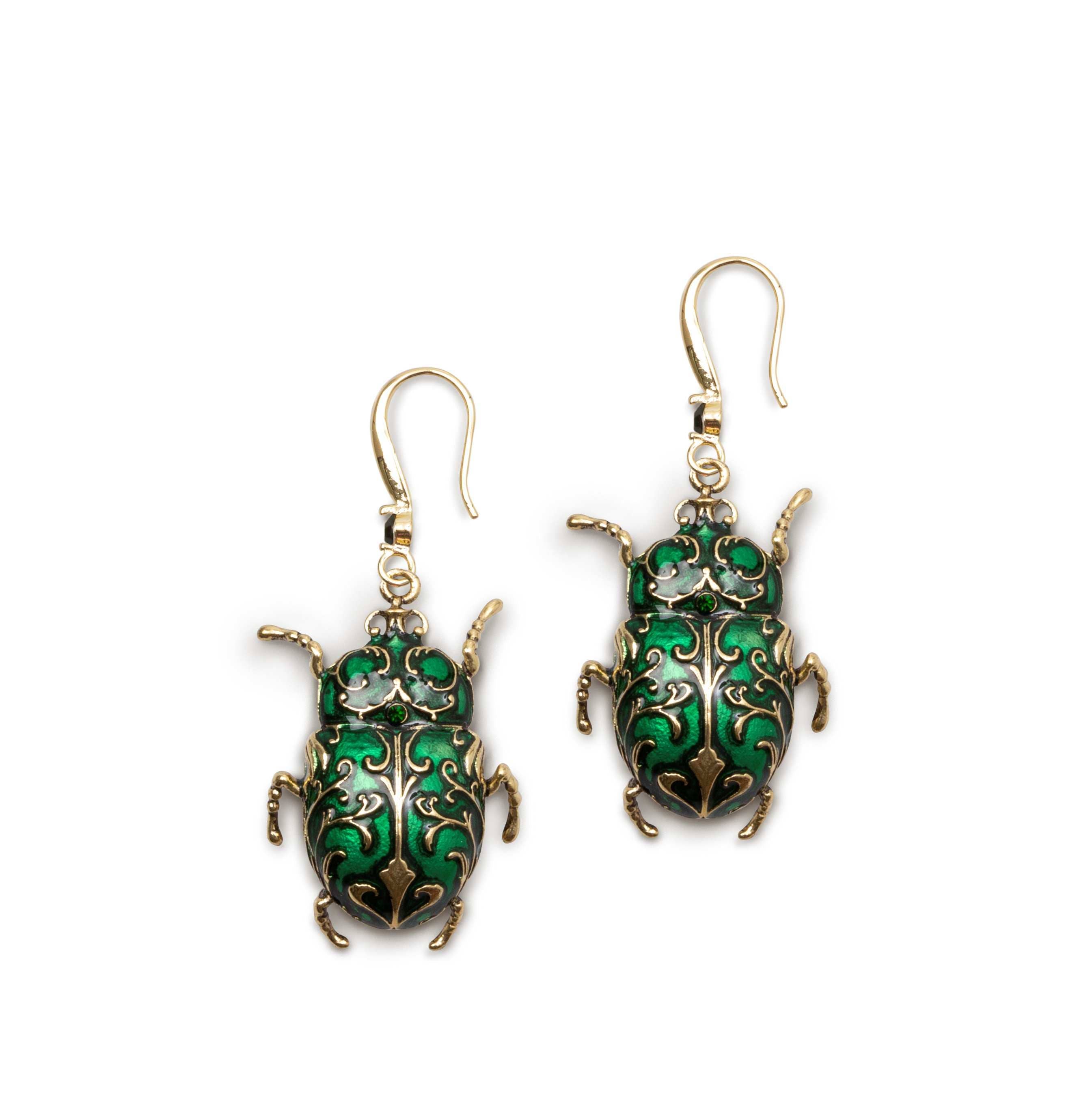 Pair of Antique Beetle Drop Earrings in green enamel and antique gold on white background.