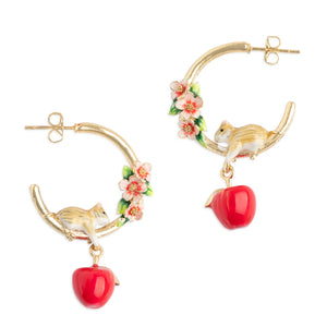 Close-up of Bill Skinner Apple Blossom & Mouse Hoop Earrings featuring gold-plated hoops, red enamel apples, and hand-painted blossoms.