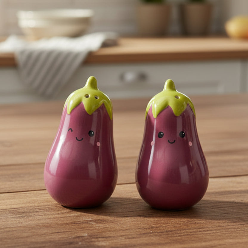 Aubergine salt and pepper shakers on wooden board with vegetables