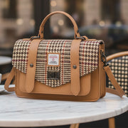 Beige dogtooth Harris Tweed medium leather satchel with adjustable shoulder strap.