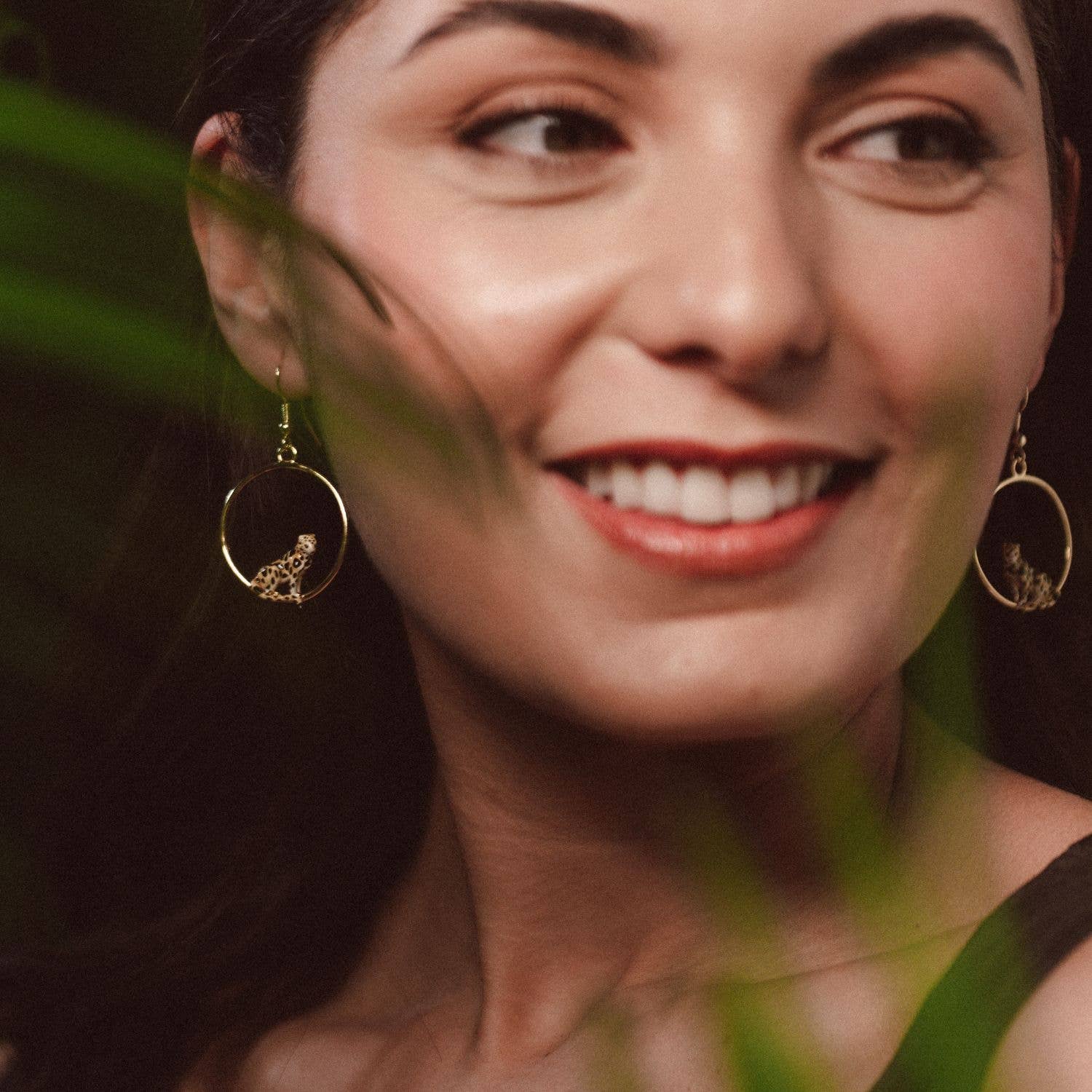 Model wearing Bill Skinner Clouded Leopard Front Facing Hoops, showing elegant gold hoops with leopard detail.