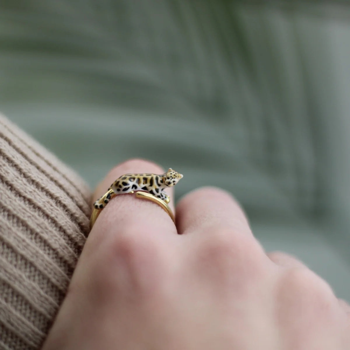 Clouded Leopard Open Ring worn on a finger, showing elegant gold finish and animal detail.