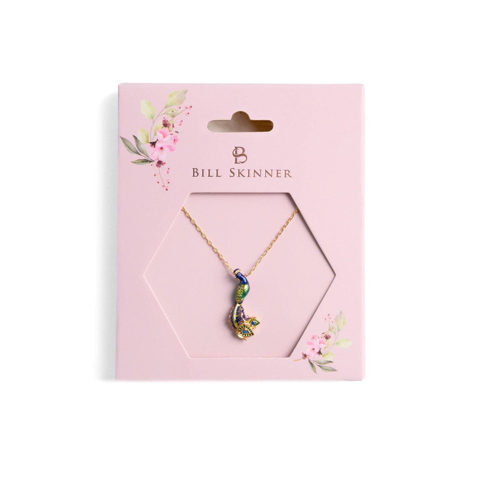 Peacock pendant necklace displayed on Bill Skinner branded pink packaging card with floral design