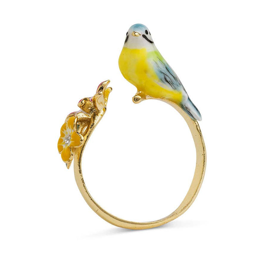Bill Skinner songbird ring with enamel bird and flower shown from side angle on white background