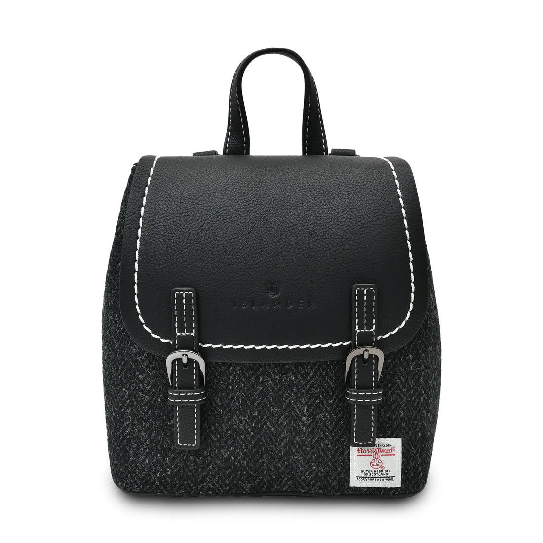 Black herringbone Harris Tweed Mini Jura backpack with black leather flap on white background.