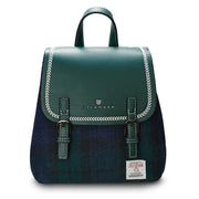 Black Watch tartan Harris Tweed Mini Jura backpack with green leather flap on white background.