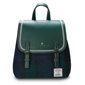Black Watch tartan Harris Tweed Mini Jura backpack with green leather flap on white background.