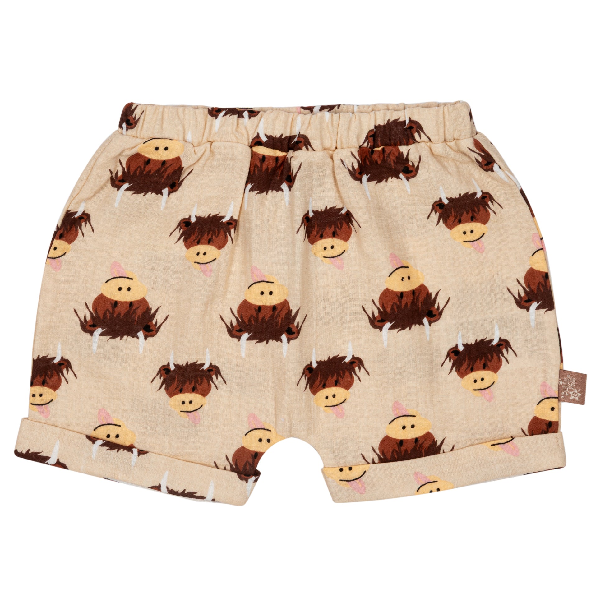 Cream highland cow cotton shorts flat lay on neutral background