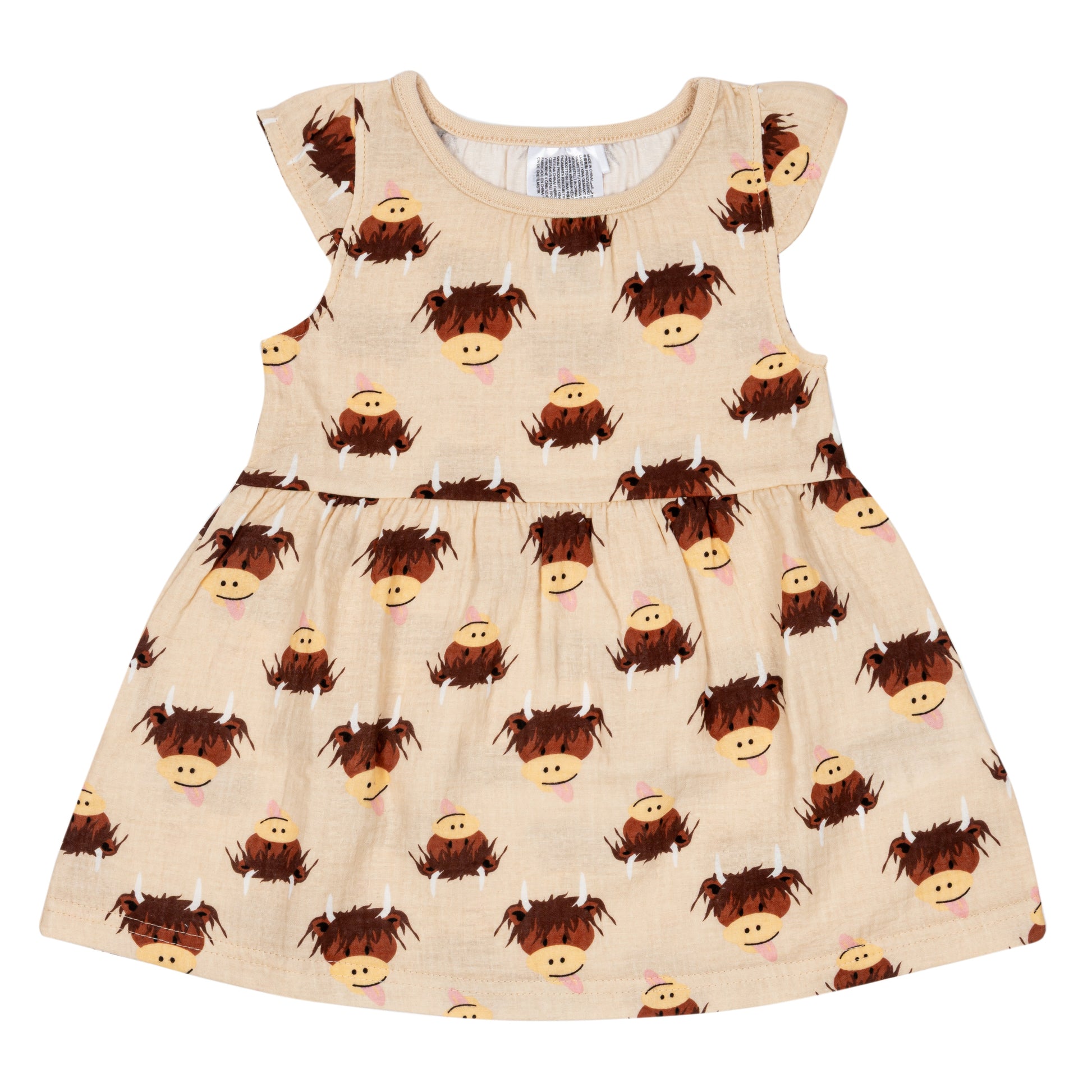 Cream highland cow dress flat lay on neutral background