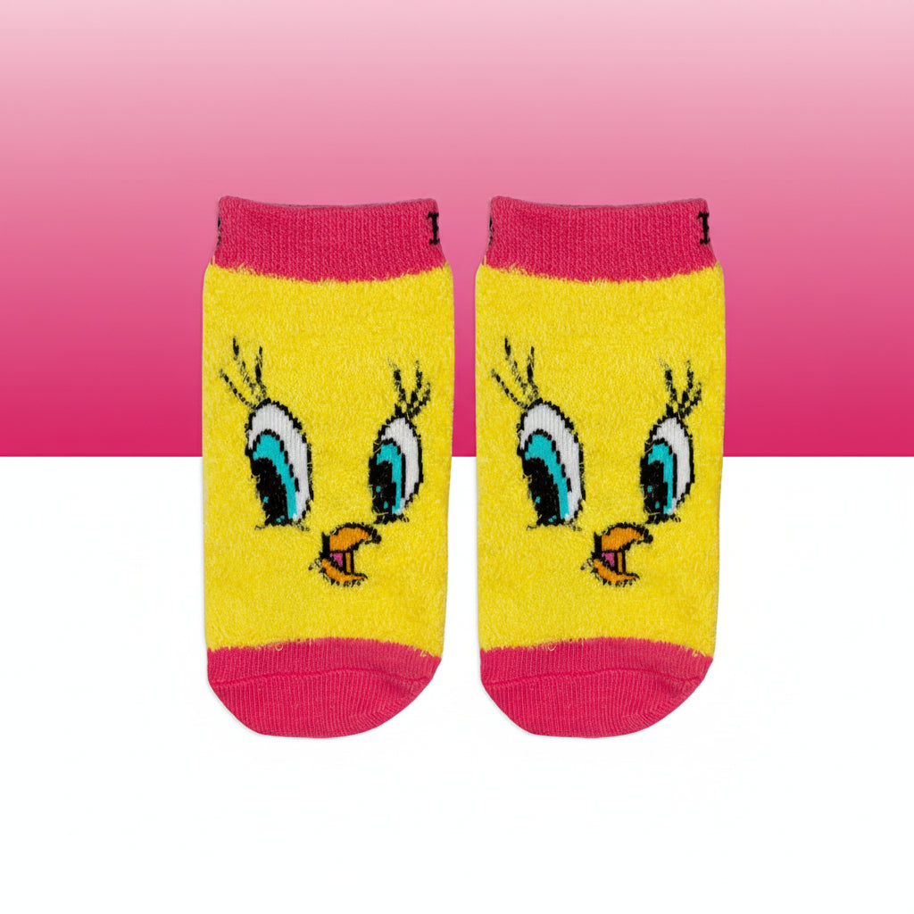 Tweety Bird socks laid flat showing character face on pink background