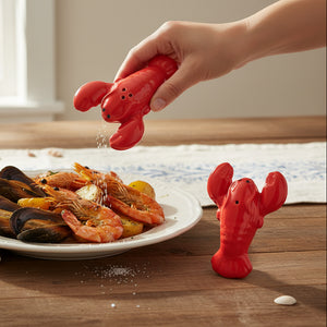 Bright red ceramic lobster salt and pepper shakers with raised claws