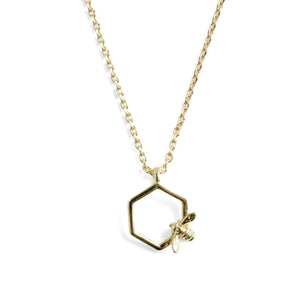Bill Skinner Bumble Bee Hex Pendant featuring a gold-plated bee resting on a hexagonal frame necklace.