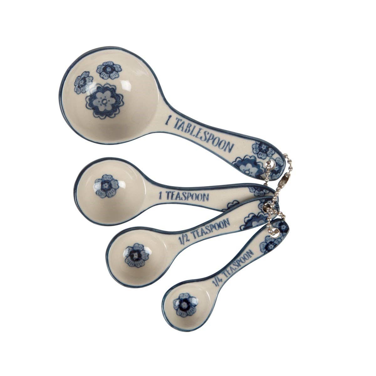 Set of four ceramic measuring spoons with blue floral designs on a white background